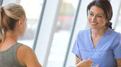 a person talking to a doctor