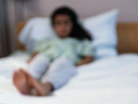 child lying on a bad