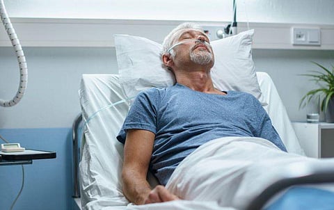 man patient hospital bed