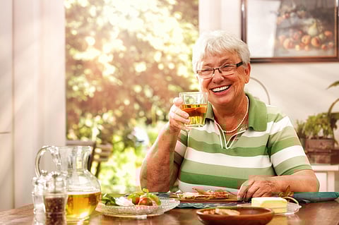 Elderly Lady has a Meal at Home