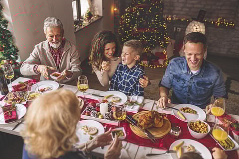 Happy family having Christmas dinner