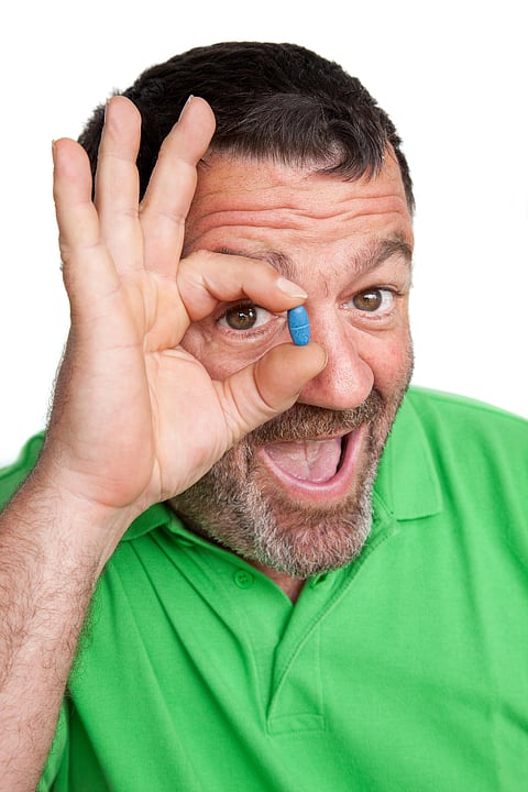 man with blue pill viagra ed drugs impotence