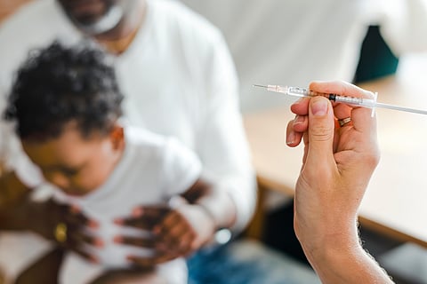 toddler getting a vaccine