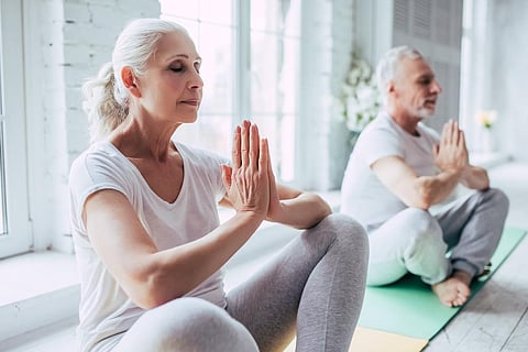 seniors practicing mindfulness, yoga