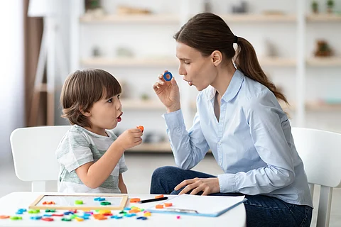 speech therapist working with child
