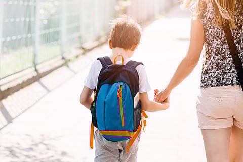 mom taking son to school