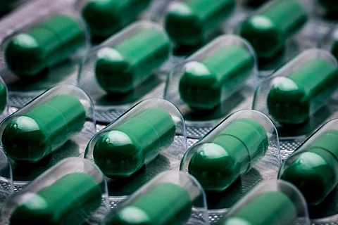 green capsule pill