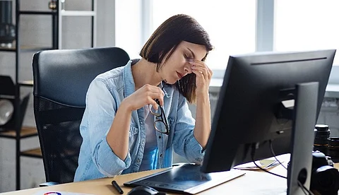 tired woman at desk