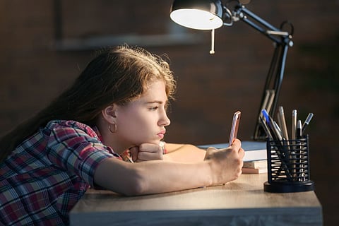 child teen sad phone