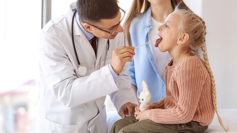 pediatrician girl doctor throat