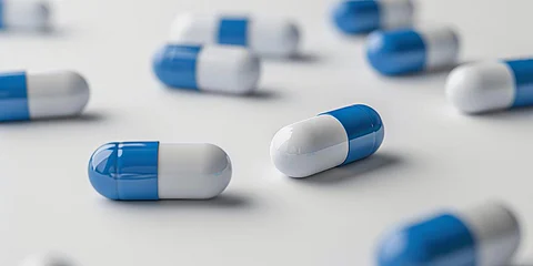 antibiotic capsule pills on white background. Pile of antibiotic drug Generative AI