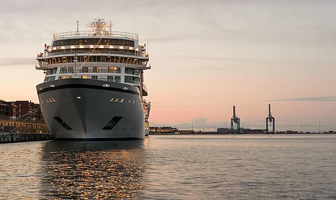 Bow of a large cruise ship at dusk moored in Copenhagen harbor in Denmark