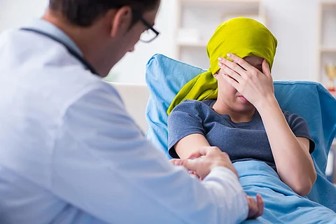 Cancer patient visiting doctor for medical consultation in clinic