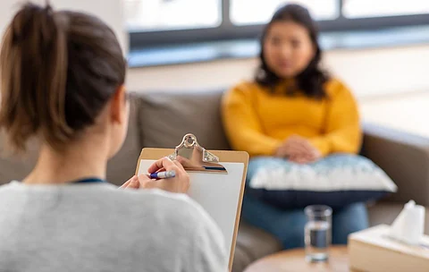 psychology, mental therapy and people concept - close up of woman psychologist and patient at psychotherapy session