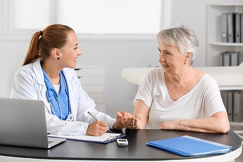 woman talking to doctor