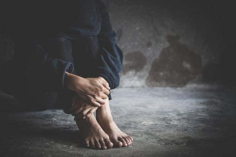 Depressed and frustrated, Sad woman sitting in the dark room, Mental health concept, Women addicted to drugs. The concept of drug abuse and traffic.