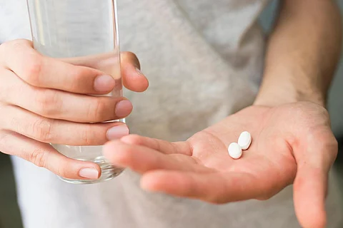 pills glass of water medications
