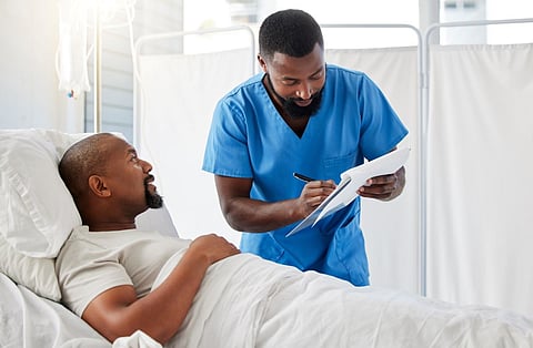 black man hospital bed hospitalization doctor
