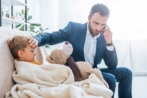 sick child parent boy fever