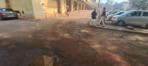 Urgent Road Repairs Needed at Mapusa District Hospital Entrance Due to Potholes