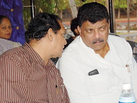 Francisco Sardinha and Churchill Alemao exchange a word at the Congress meeting at Navelim.