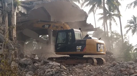 Heavy machinery used to demolish the illegal hotel at Velsao