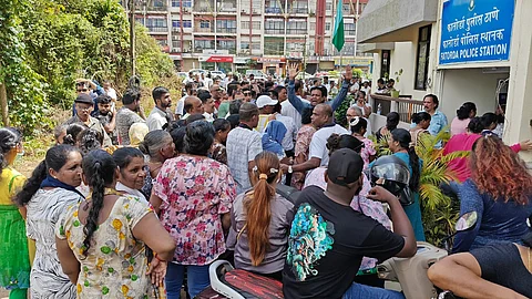 Protestors outside the Fatorda Police on Saturday demanding the arrest of Subhash Velinkar.