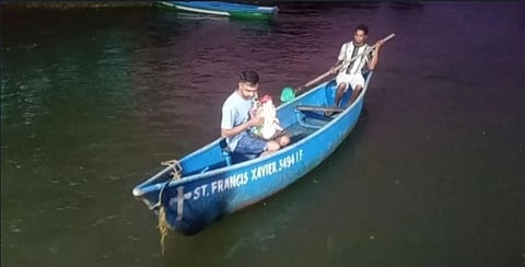 Shailesh Quencro carried his Ganesh idol for immersion, on a boat rowed by a Catholic boatman. The boat is named St Francis Xavier.