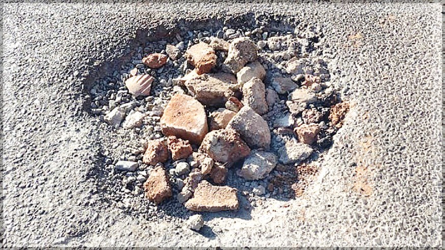 Newly Repaired Road in Sangolda Poses Danger to Motorists Due to Bricks in Inspection Pits