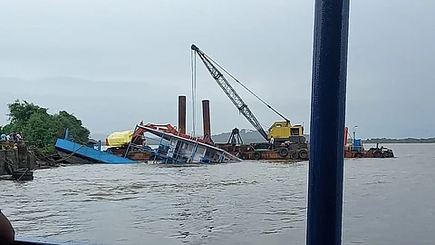 Efforts begin to refloat the sunken ferry, The authorities have begun the process to remove the partially submerged ferry boat from the Mandovi river at Chorão
