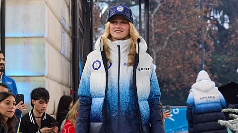 Laura Kangasniemi ja Suomen talviolympia-asu.