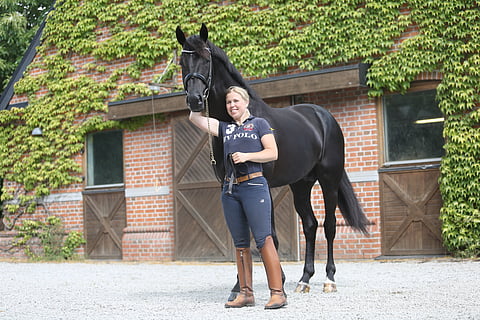 Yvonne Österholm ja ironman H kotitallillaan vuonna 2018.