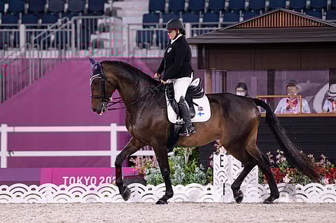 Pia Reitti ja Supremo Tokion paralympialaisissa.