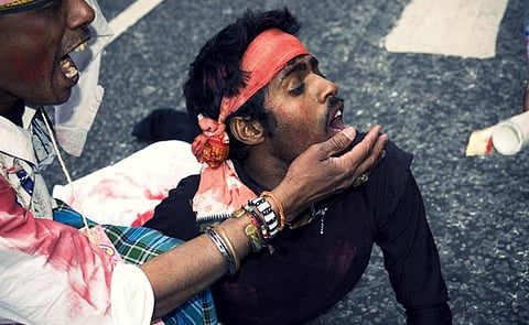 A dramatic recreation of anti-Tamil violence acted out by demonstrators at a 2009  protest in London. Image: CC license, flickr user lewishamdreamer.