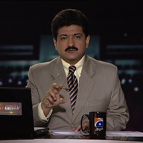 Hamid Mir in a TV studio.