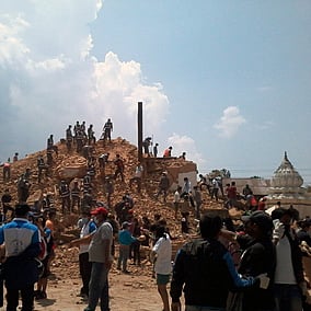 Volunteers and police personnel at work in clearing the debris at Kathmandu's Kalmochan temple.
Photo: Shubhanga Pandey