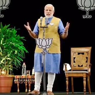 Narendra Modi at the hustings, and in hologram. (Source: Flickr / Narendra Modi)