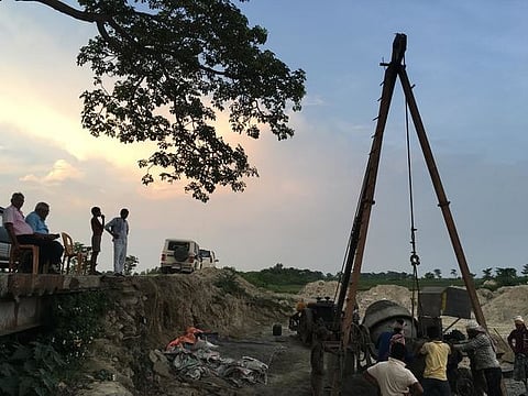 Indian engineers from the Kosi Project overseeing a contractor and labourers building a bridge along the Sundari River after it joins with the Mahuli River in Saptari District.