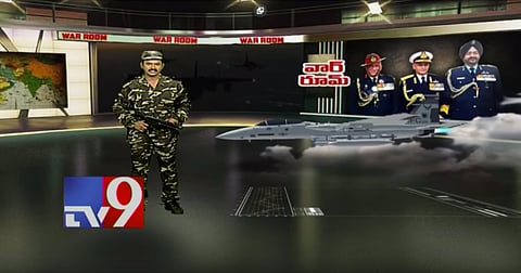 A Telugu news anchor from TV9 sporting combat fatigues and a toy gun for a broadcast on the Pulwama attack. Photo: TV9 Telugu Live / YouTube