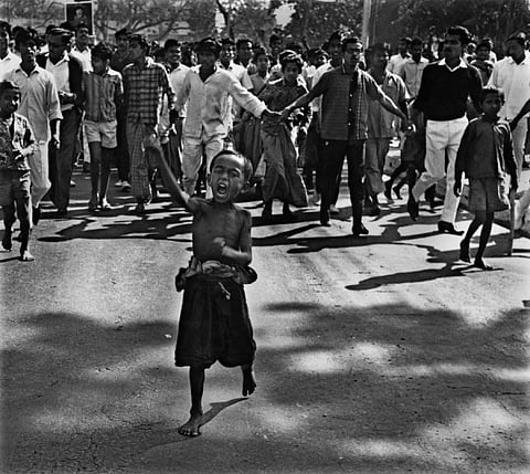 “A street child, or “tokai” leads a procession during the mass uprising of 1969. Police bullets
killed the child soon after the photograph was taken. Dhaka, 1969” by Rashid Talukder. Photograph courtesy: Rashid Talukder / Drik Picture Library / Chobi Mela