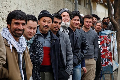 Voters line up outside a polling station in Kabul during the 2014 presidential election.
Photo: un_photo / Flickr