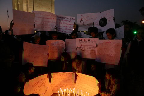 Protesters hold vigil at India Gate to condemn the brutal gang-rape of a woman in 2012.