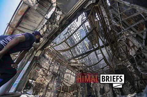 Irfan, a Sri Lankan Muslim businessman inspects his vandalised shop, Mohideen City Shoe Palace, following sectarian clashes in Minuwangoda, Sri Lanka. May 2019. Photo: ZUMA Press / IMAGO