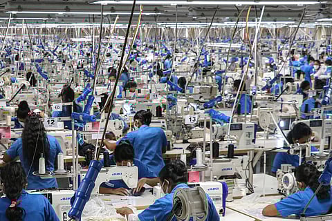 Workers at a garments factory in Sandalankawa, Sri Lanka. If decades of state intervention and labour-friendly legislation made Sri Lanka’s relative success possible, what are the lessons for us today? Photo: Pacific Press Agency / IMAGO