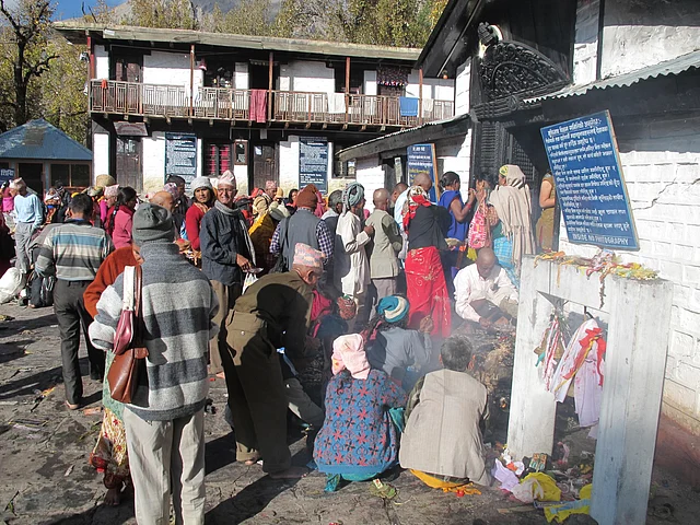 Pilgrims seeking a glimpse inside the Vishna Mandir, Muktinath.