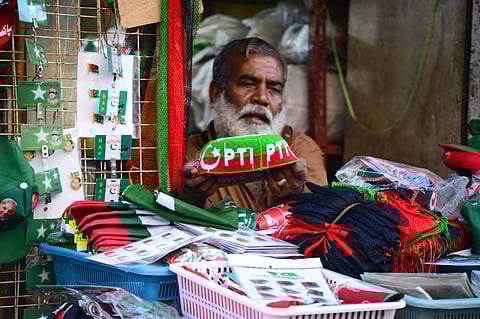 Merchandise on display in Karachi for supporters of different political parties in Pakistan’s general election on 8 February. The main contest is between Nawaz Sharif’s PML–N and Imran Khan’s PTI in a skewed political field that favours the former candidate. Photo courtesy: IMAGO / Newscom World