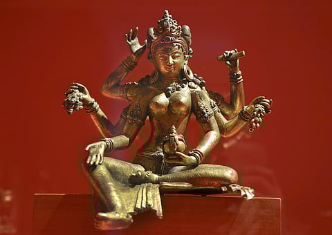 A 17th-century statue of the goddess Vasudhara from Nepal, displayed at the Museum Angewandte Kunst in Frankfurt. Western publications and collections of Himalayan cultural artefacts often present little information on their original context or provenance, masking how these objects may have been acquired by less than ethical means. Photo: IMAGO / epd