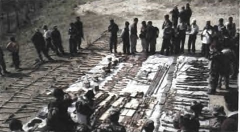 Tools of war: captured Maoist weapons (including rows of picks and shovels) following the Khara battle.