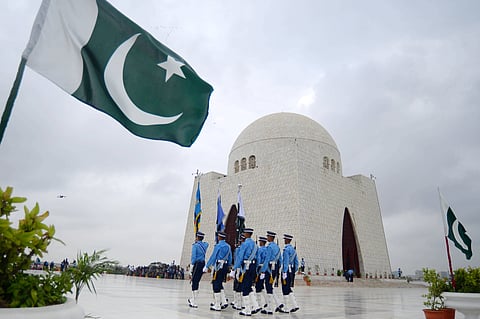 Military personnel march at the mausoleum of Muhammad Ali Jinnah, the founder of Pakistan, during a ceremony to mark the Defense Day in Karachi. (This featured image was added online in 2024, and did not appear in the original print publication.)
