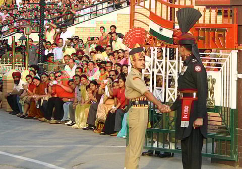 Guards at the India-Pakistan border. (This featured image was added online in 2024, and did not appear in the original print publication.)